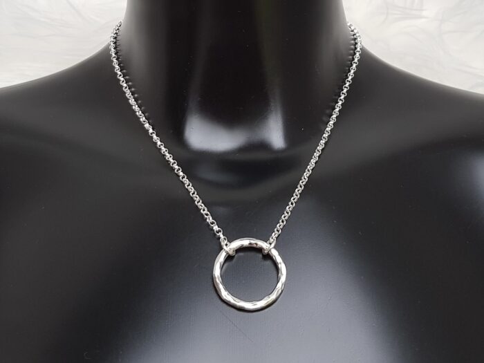 Circle of Life large sterling silver hammered ring necklace for fundraising on bust